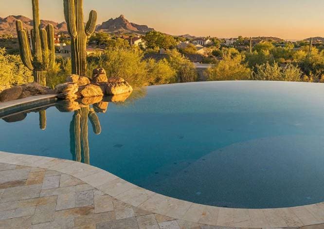 Cleaned pool deck with sparkling blue water in Phoenix, AZ" 3