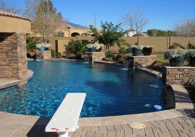 Cleaned pool deck with sparkling blue water in Phoenix, AZ" 4